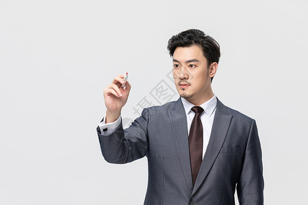 商务男性拿白板笔写字中国人高清图片素材