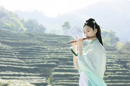 汉服古装美女吹竹笛背景