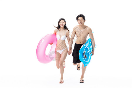 夏日泳装情侣拿着游泳圈背景图片