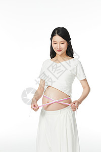 孕妇用皮尺量肚子维度背景