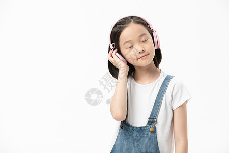 小女孩头戴耳机学习少儿高清图片素材