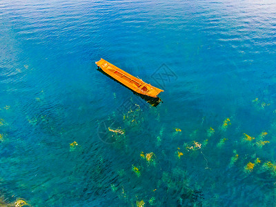 黄色小船泸沽湖航拍小船背景