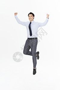 商务男性跳跃举手庆祝图片