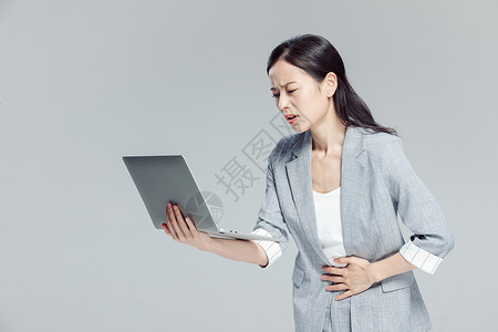 商务女性白领腹部疼痛图片