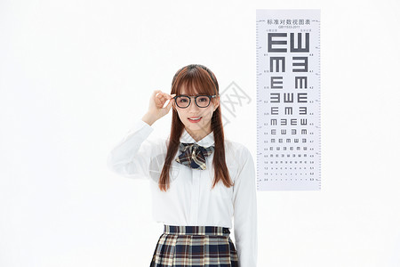 爱眼日公益海报佩戴眼镜的大学生视力测试背景
