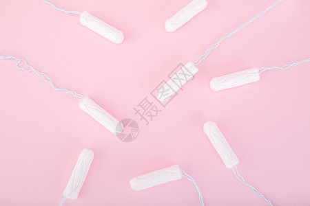 粉色背景上的卫生巾卫生棉背景图片
