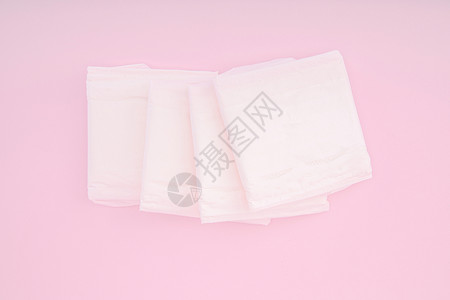 粉色背景上的卫生巾背景图片