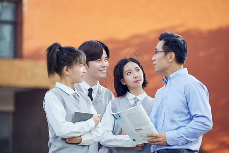 教师节校园里老师和学生交谈背景