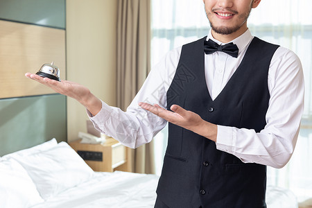 酒店客房服务员拿服务铃管理高清图片素材