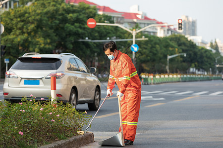 户外打扫城市街道的环卫工人背景图片
