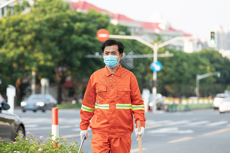 户外打扫城市街道的环卫工人背景图片