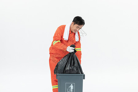 环卫工人清理垃圾桶背景图片