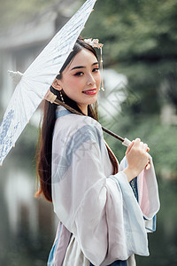 中国风古风汉服美女雨中撑伞图片