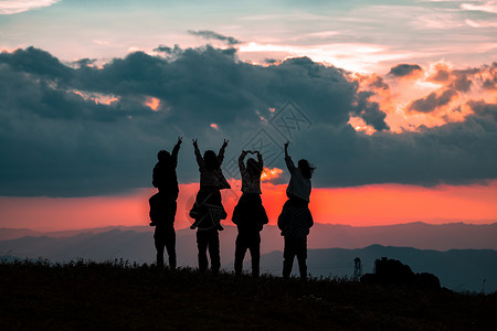 夕阳情侣人像剪影摄影图片背景图片