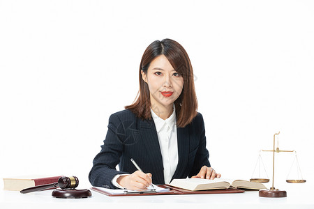 青年女性律师办公写字高清图片