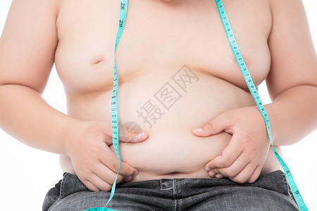 男孩用软尺测量腰围肥胖背景图片