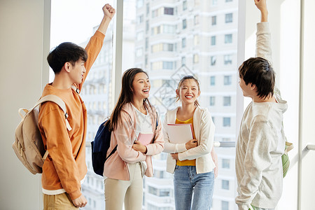 装满书本书包考研学生加油欢呼背景