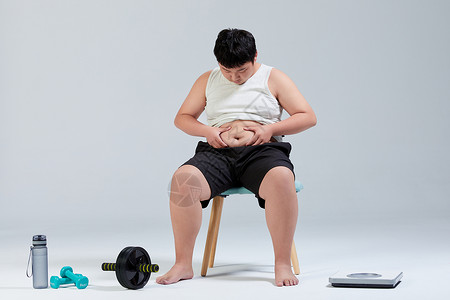 肥胖青少年摸肚子的小胖子运动减肥背景