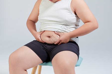 青少年肥胖摸肚子的小胖子运动减肥背景