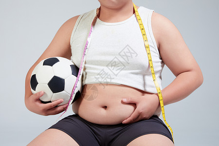 健身男孩努力减肥的小胖墩特写背景