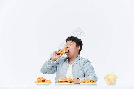 高热量食品青少年肥胖吃汉堡背景