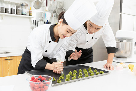 学生美食素材烘焙学校老师教学生做饼干背景