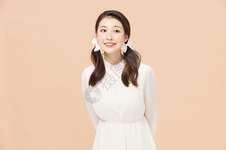 韩系装扮双马尾青春可爱少女背景图片