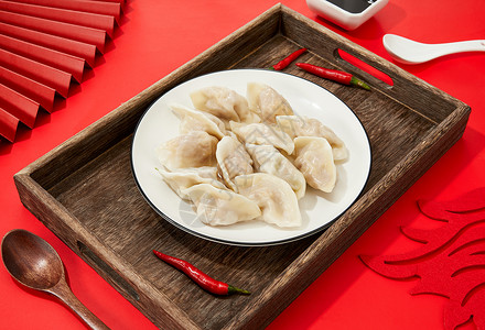 南方春节习俗红色背景上的饺子水饺背景