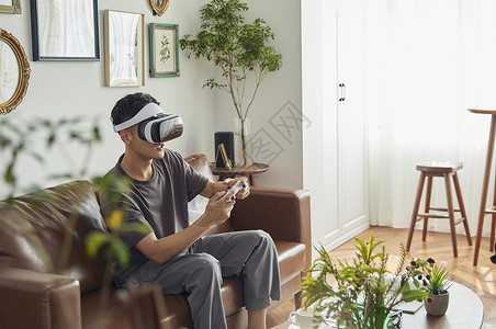 科技相框素材年轻男士居家VR眼镜游戏体验背景