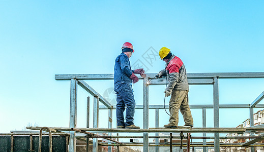 工厂料罐素材高层建筑工地建筑焊接作业背景