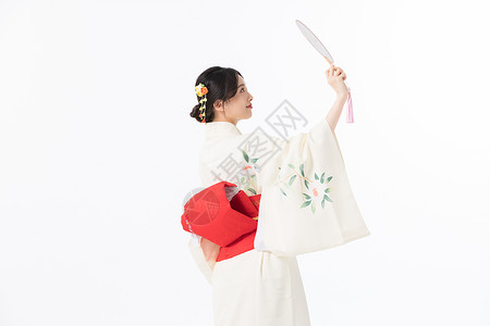 日本民族服饰穿和服美女手拿扇子背景