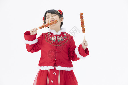 小女孩吃冰糖葫芦图片