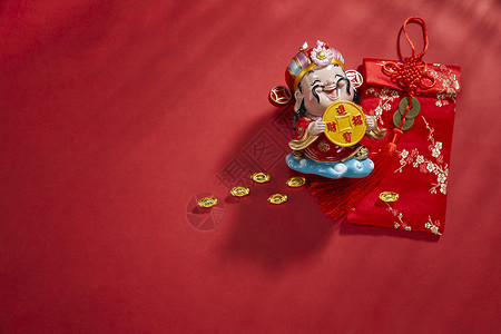 红色福袋新年静物元宝和财神背景