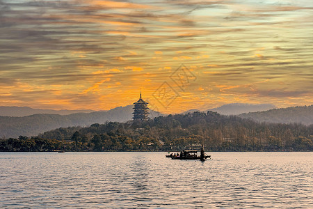 夕阳船中国浙江杭州西湖雷峰塔风景背景