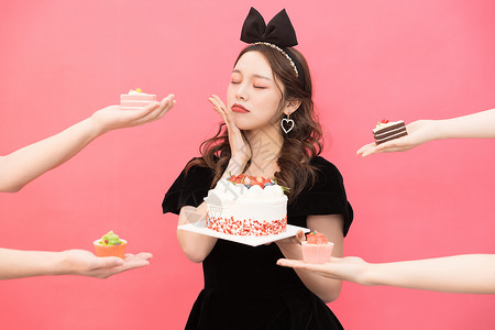 餐食物糕点年轻时尚女性吃蛋糕甜点背景
