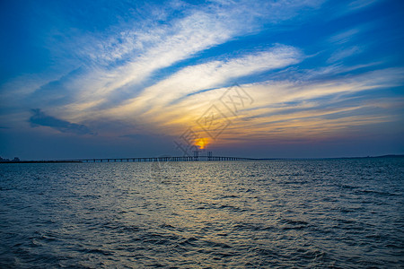 蔚蓝海青岛胶州湾夕阳晚霞海上日落背景