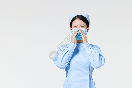 戴口罩女护士护士展示口罩带法背景