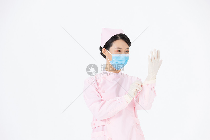 戴医疗手套的医护人员图片