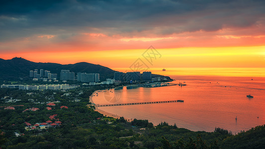 海南三亚鹿回头景区夕阳落日高清图片