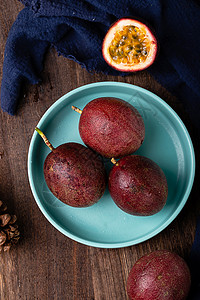 紫色小果果热带水果百香果美食摄影图片背景