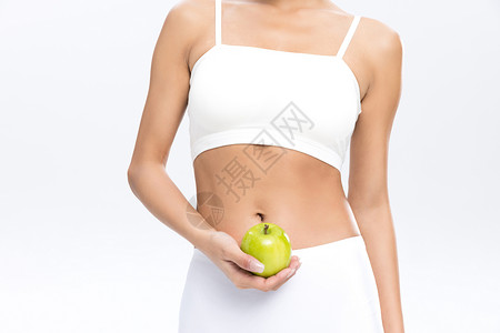 肌肉纤维塑形塑身美女手拿苹果饮食管理背景