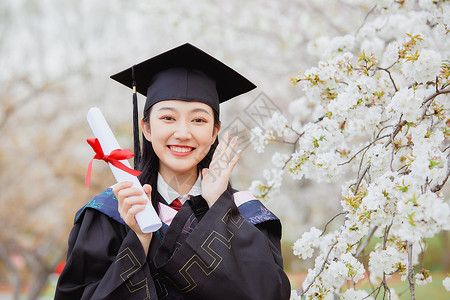 女大学生公园花季毕业照毕业季高清图片素材