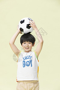童真小男孩玩足球中国人高清图片素材