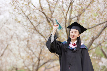 学士服美女扔纸飞机学习高清图片素材