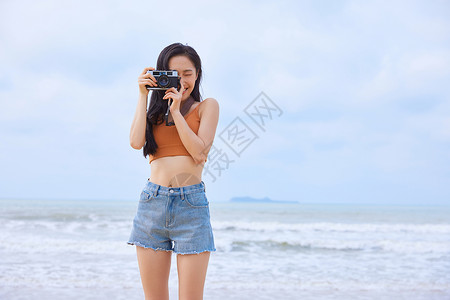 沙滩比基尼美女写真海边旅行拍照的女生背景