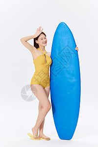 夏日泳装美女与冲浪板背景图片