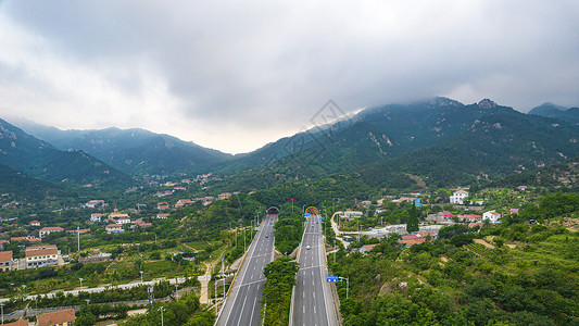 航拍青岛滨海大道仰口隧道背景图片