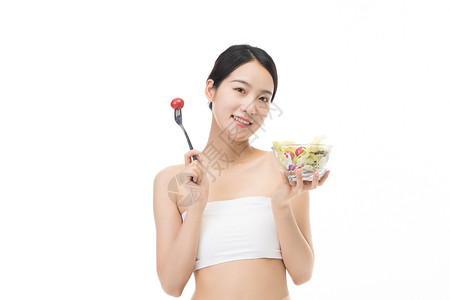 吃蔬菜沙拉的健康养生美女背景图片