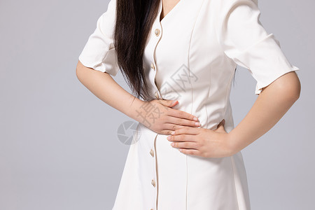 腹部疼痛的女性局部特写背景图片