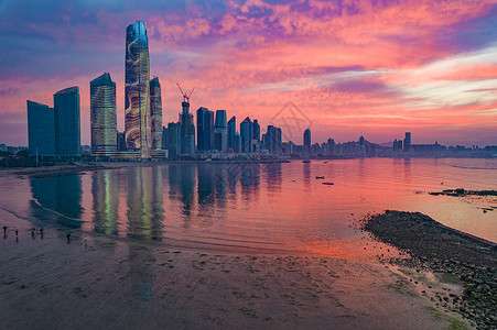 海天中心青岛东部城区海滨晨景火烧云背景